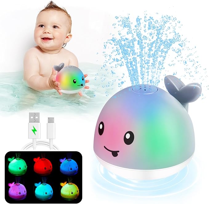 Baby bathing while playing with toys